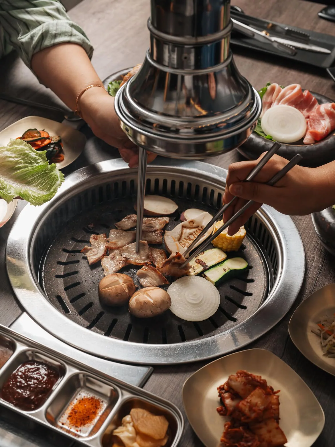 Korean barbecue cooking at the table